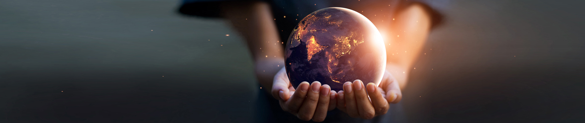 Young person holding out a earthly sphere