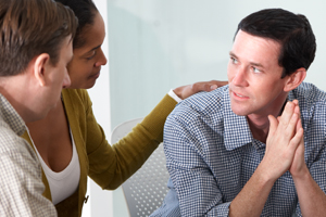 Group of people having a caring intervention meeting
