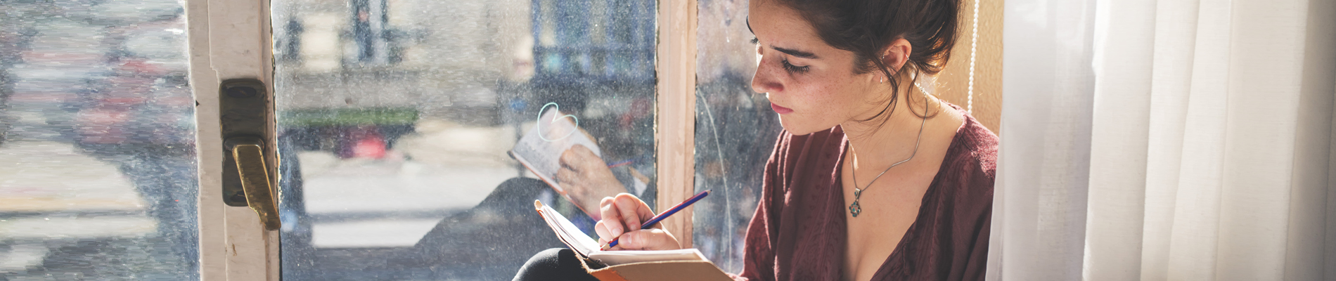 Woman writing in her journal