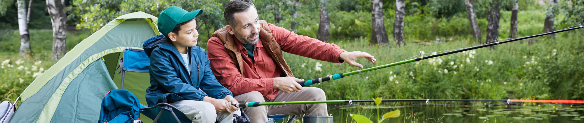 father and son camping and fishing