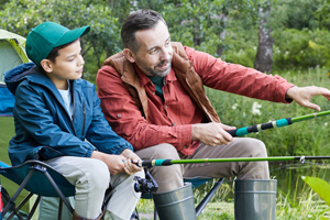father and son camping and fishing