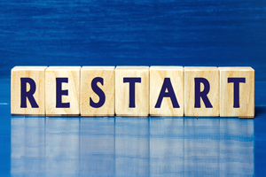 wood blocks spelling out RESTART