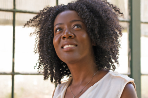 Woman grinning looking aloft