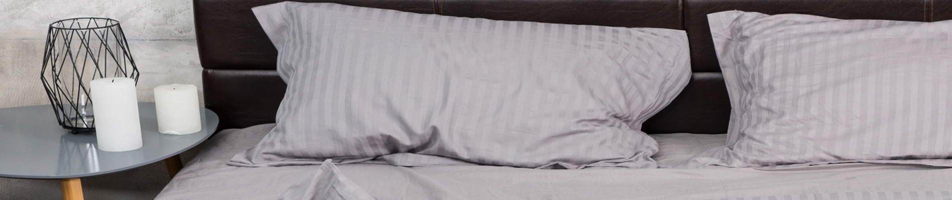 Bed with pillows and night stand