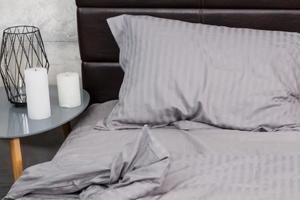 Bed with pillows and night stand