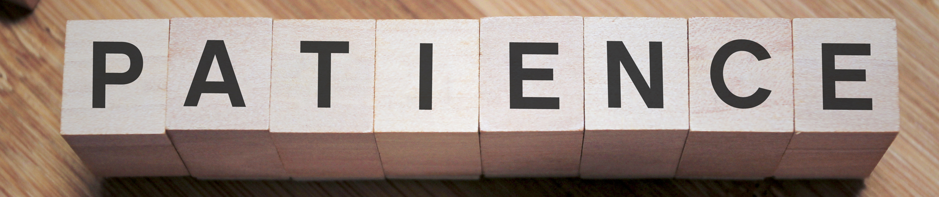 Wood blocks spelling out patience