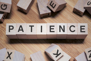 Wood blocks spelling out patience