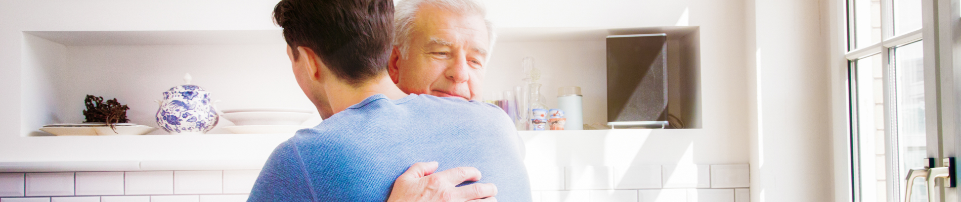 Two men hugging in acceptance