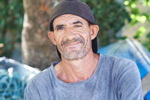 Grinning man in woods