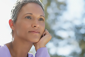 Woman gazing out near a body of water