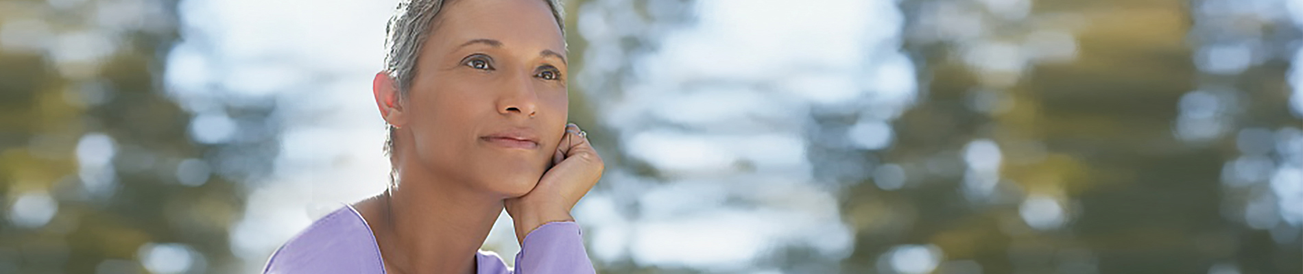 Woman gazing out near a body of water