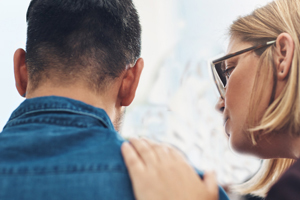 young couple sitting in a room have a heart to heart discussion